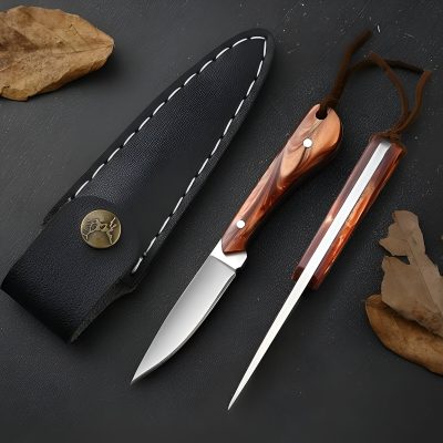 Stainless steel knives with wooden handles on black surface, surrounded by autumn leaves, showcasing high-quality kitchen utensils for home and professional cooking.