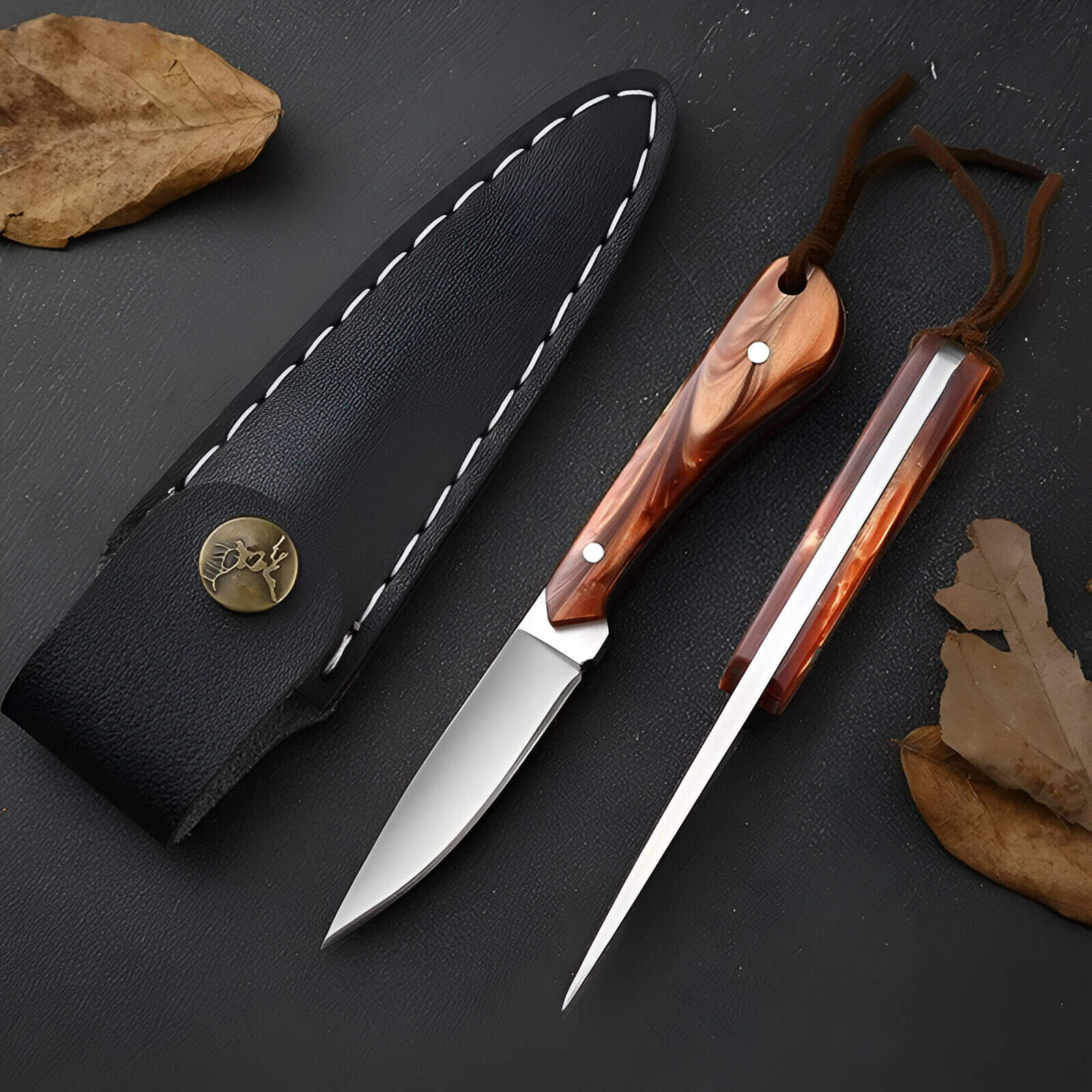 Stainless steel knives with wooden handles on black surface, surrounded by autumn leaves, showcasing high-quality kitchen utensils for home and professional cooking.