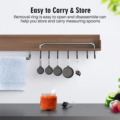 Stainless steel hanging pot rack with removable rings for easy storage and organization of cookware in kitchen, featuring mounted utensils and clutter-free countertop space.