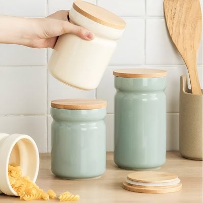 Stylish ceramic storage jars with bamboo lids for kitchen organization and food preservation at Monalisa Store. Elegant design complements modern home decor, ideal for pantry or countertop use.