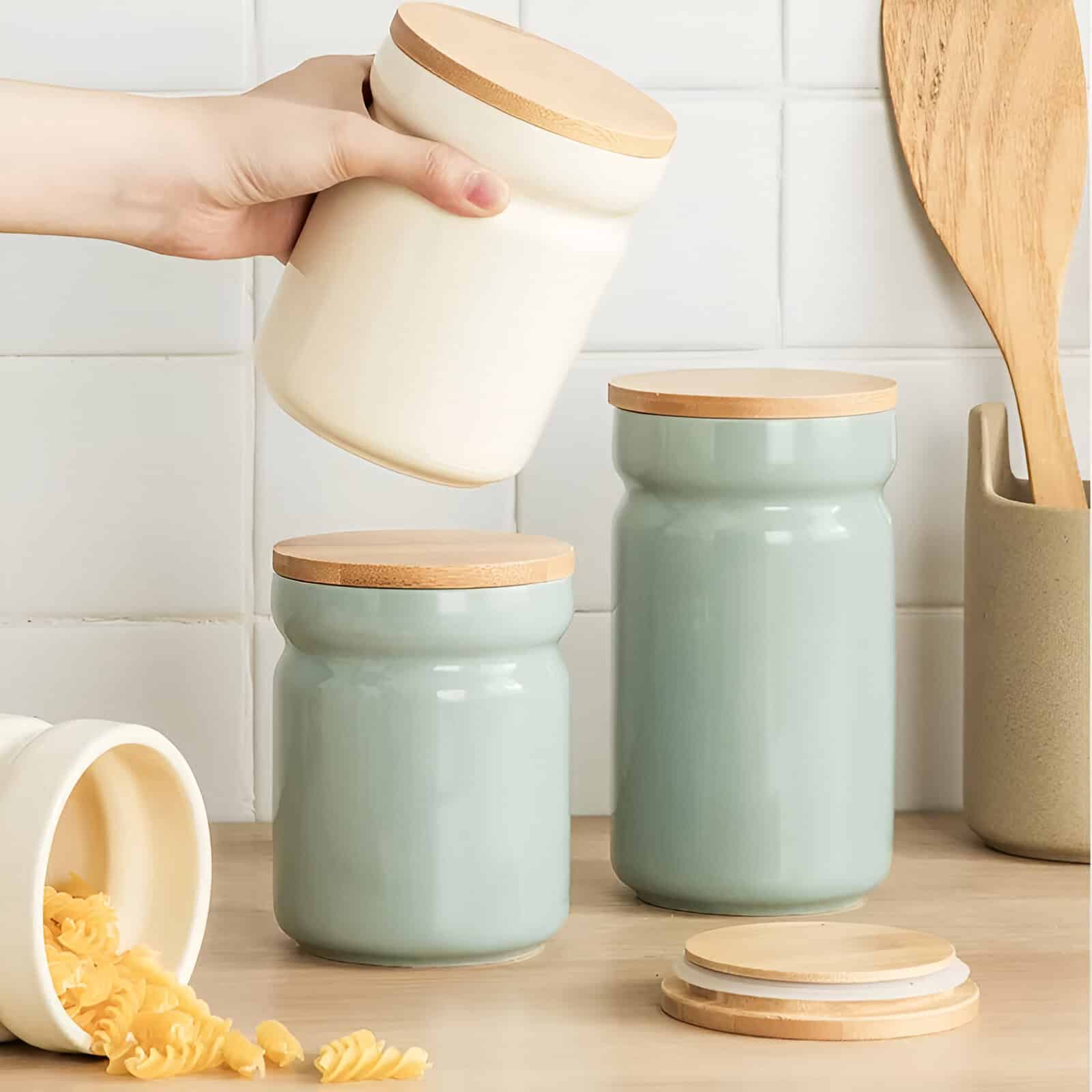 Stylish ceramic storage jars with bamboo lids for kitchen organization and food preservation at Monalisa Store. Elegant design complements modern home decor, ideal for pantry or countertop use.