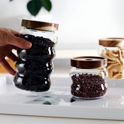 Refreshing black and red beans stored in glass jars with wooden lids, ideal for healthy diet options at Monalisa Store.