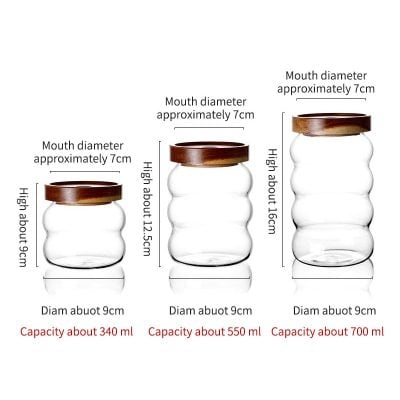 Elegant glass storage jars with wooden lids, ideal for kitchen organization and decorative purposes, available in various sizes at Monalisa Store.