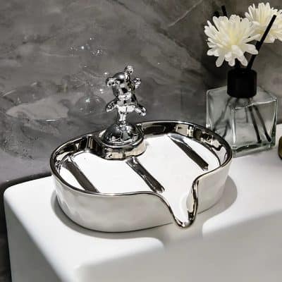 Shiny silver vanity tray with a bear-shaped handle on a white surface, decorative bathroom accessories, elegant home decor, luxury bathroom essentials, Monalisa Medical store.
