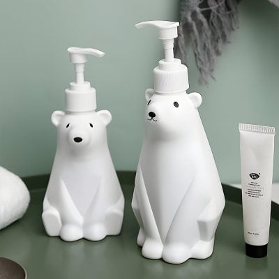 Cute bear-shaped lotion and soap dispensers with a modern, minimalist design, ideal for bathroom decor at Monalisa Medical Store.