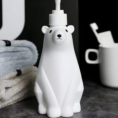 Whimsical bear-shaped soap dispenser with a cute face, ideal for bathroom or kitchen decor, combining functional design with playful style. Perfect for adding charm to your skincare routine.