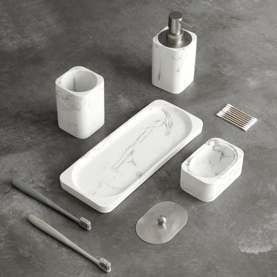 White marble bathroom accessory set with soap dispenser, toothbrush holder, soap dish, and tray, ideal for modern bathroom decor and organization.