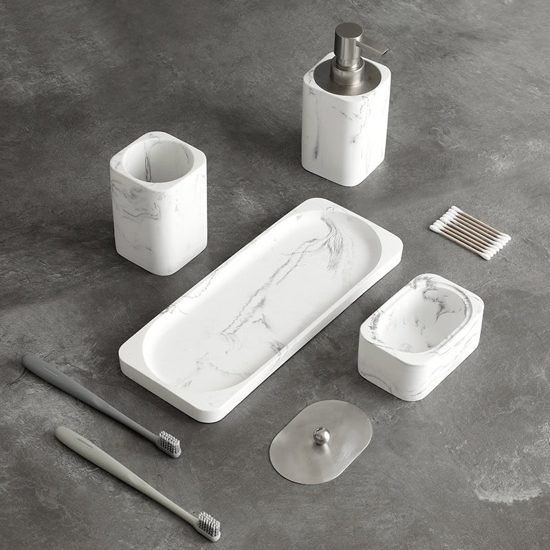 White marble bathroom accessory set with soap dispenser, toothbrush holder, soap dish, and tray, ideal for modern bathroom decor and organization.