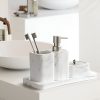Elegant marble bathroom accessories including toothbrush holder, soap dispenser, and tray, perfect for modern optometry clinics and eyewear stores like Monalisa Store.