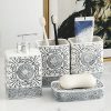 Elegant black and white patterned bathroom accessories set including soap dispenser, toothbrush holders, soap dish, and storage jars, designed for a stylish and organized bathroom decor.
