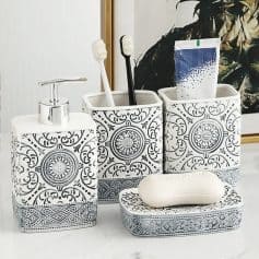 Elegant black and white patterned bathroom accessories set including soap dispenser, toothbrush holders, soap dish, and storage jars, designed for a stylish and organized bathroom decor.