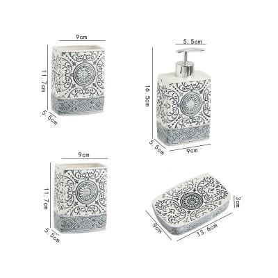 Elegant ceramic bathroom accessory set with black and white intricate floral patterns, includes soap dispenser, toothbrush holder, and soap dish, perfect for modern bathroom decor.