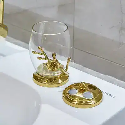 Decorative glass with a gold reindeer figurine for luxury home decor and gift idea, featuring gold accents and elegant design.