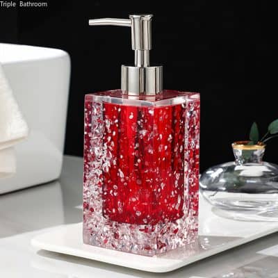 Red and silver decorative liquid soap dispenser with a modern square design, perfect for stylish bathroom or vanity decor.