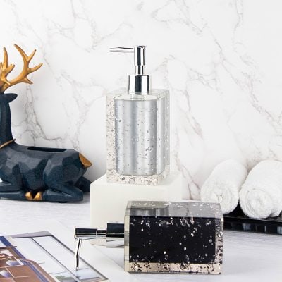 Monalisa store luxury bathroom accessories with soap dispensers and decorative elements, modern design, high-quality finishes, elegant marble background opt for stylish and functional bathroom decor.