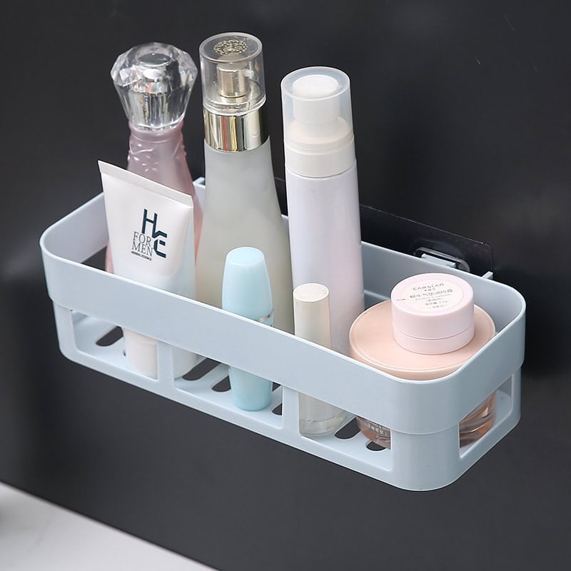 Moisturizer and skincare products organized in a bathroom shower caddy for daily skincare routine.