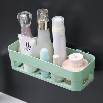 Hydrating skincare products and cosmetic containers organized in a mint green bathroom basket, ideal for daily skincare routines and beauty treatments at Monalisa Store.