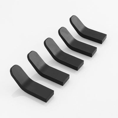 Black dental aligners or orthodontic appliances on white background, professional teeth correction tools for smile improvement.