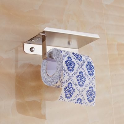Discreet toilet paper holder with decorative blue and white patterned tissue for bathroom hygiene and aesthetic enhancement.