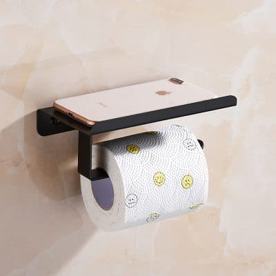 Modern wall-mounted toilet paper holder with a shelf for smartphone storage, featuring a sleek black design perfect for bathroom organization and convenience.
