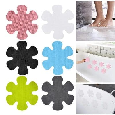 Flexible silicone bath scrubbers in pink, white, black, blue, green, and gray, perfect for gentle cleaning and exfoliation.