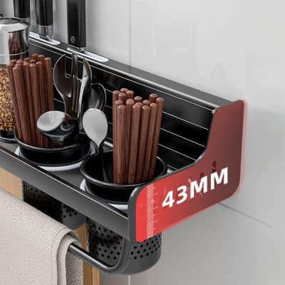 Stainless steel kitchen utensil rack holding cooking spoons, chopsticks, and kitchen tools with measurement marks for optimal storage and organization.