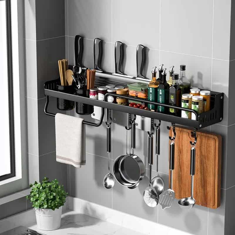 Stainless steel wall-mounted kitchen utensil rack with hooks for pots, pans, knives, spices, and utensils, ideal for organizing a modern kitchen.