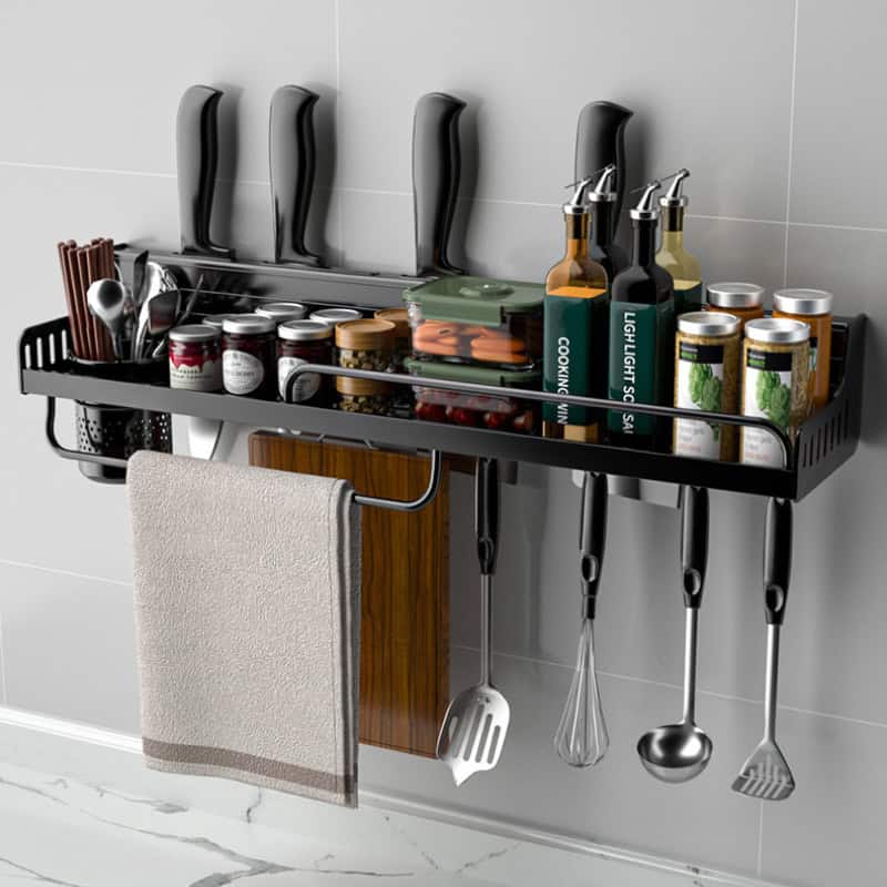Spice rack and kitchen utensil organizer mounted on wall with spices, oils, and cooking tools, perfect for modern kitchen storage solutions.