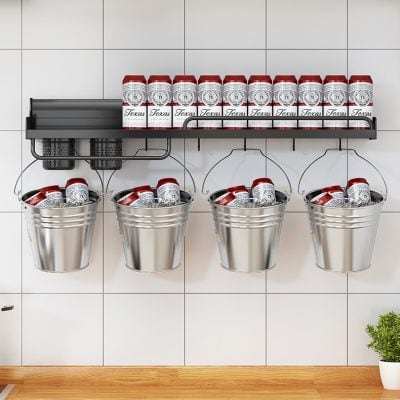 Red Texas-themed cans on a black shelf and in metal buckets in a modern optometry store.
