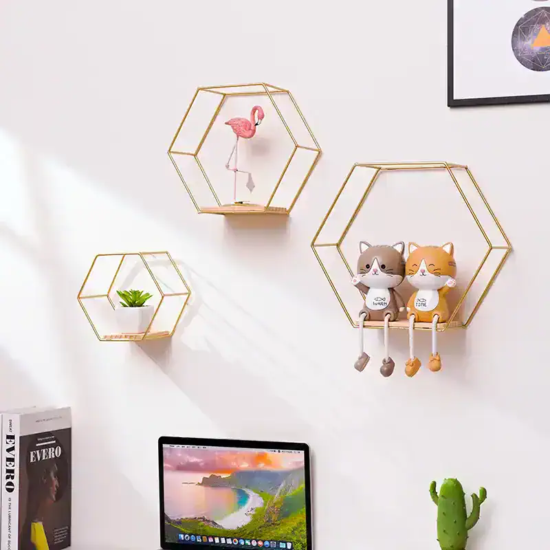 Colorful geometric wall shelves with decorative toys, plants, and a computer monitor creating a modern, playful, and organized workspace aesthetic.