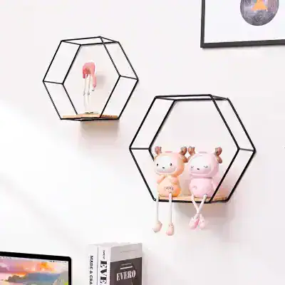 Cute plush toys on modern black hexagonal wall shelves in a stylish room decor setup for kids' room, nursery, or children's play area.