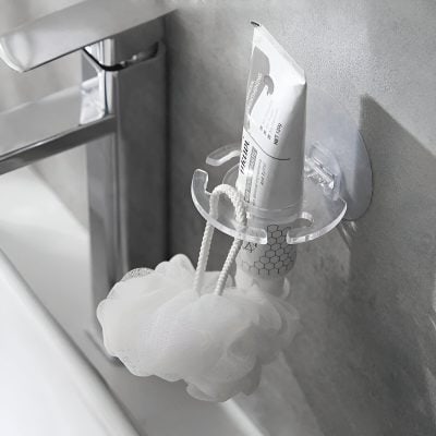 Disinfectant soap dispenser mounted on the wall at Monalisa Store, promoting hygiene and cleanliness in the optometry and eyewear retail environment.