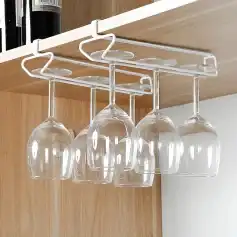 Glass wine glasses hanging from a ceiling rack, ideal for bar or restaurant settings, featuring a sleek and modern design. Perfect for enhancing dining or beverage service experience.