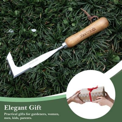 Stainless steel gardening hoe with wooden handle lying on green grass, ideal for gardening tools and outdoor activities.