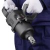 Heavy-duty pneumatic impact wrench being used by a technician wearing white gloves, suitable for industrial and automotive repair.