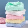 Soft pastel-colored baby blankets stacked, perfect for newborns and infants, ideal for photo props, nursery decor, and baby showers. Soft, gentle fabrics for delicate skin.