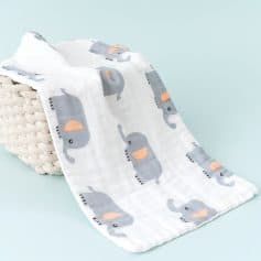 Soft baby muslin blanket with cartoon elephants, perfect for infants and toddlers, made from breathable, high-quality fabric for gentle comfort and easy care.