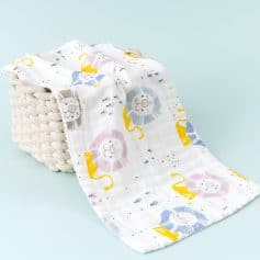 Kids organic cotton swaddle blanket with lion print for baby's comfort and sleep.