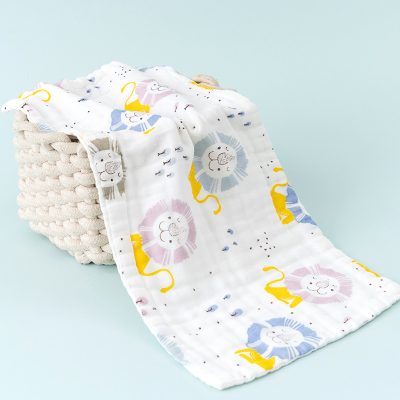 Kids organic cotton swaddle blanket with lion print for baby's comfort and sleep.