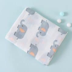 Soft baby blanket with cute gray elephants and pastel accents, perfect for nurseries and gifts.