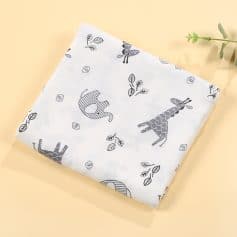 Soft baby blanket with giraffe and elephant print, ideal for newborns and toddlers, featured at Monalisa Store for premium children's bedding and accessories.