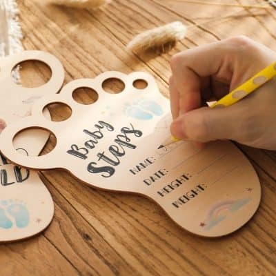 Baby record template with baby footprints and spaces for name, date, height, and weight, perfect for newborn milestone tracking.