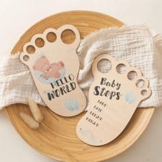 Hello world baby footprints announcement card with cute bear design for newborns and baby milestones, ideal for maternity or nursery decor at Monalisa Medical Store.