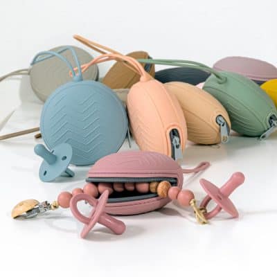 Colorful silicone baby teething pacifiers and chew toys in pastel shades, designed for infant oral comfort and teething relief, showcased in Monalisa Store's modern collection.