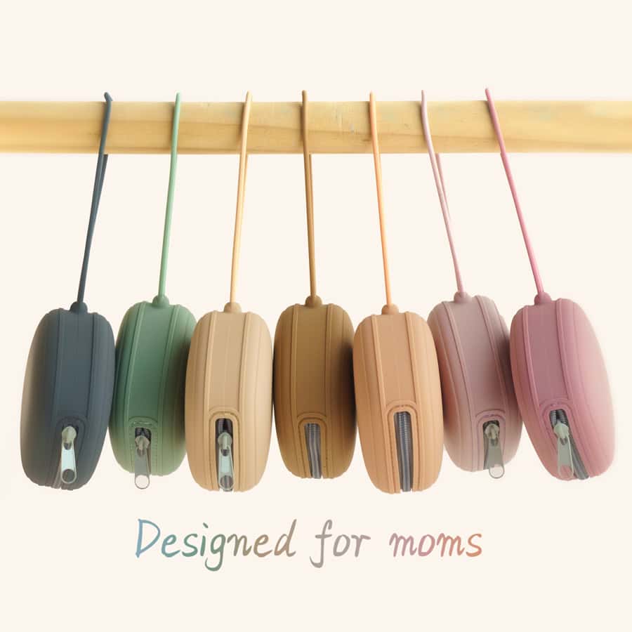 Colorful silicone lunch boxes hanging on a wooden rack, designed for moms, ideal for kids' meals and snack storage at Monalisa Store.