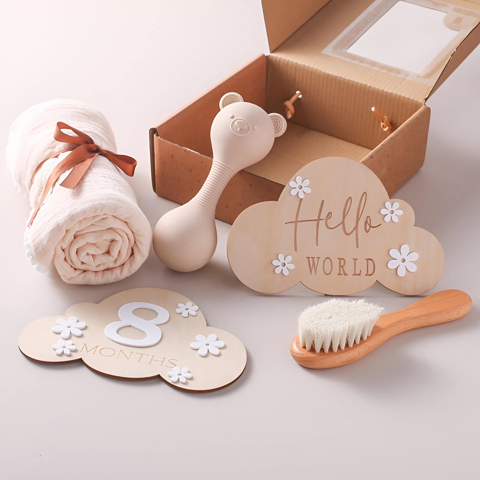 Soft plush baby blanket bundle with care brush, decorative "Hello World" and "8 Months" signs, perfect for infant milestone gifts and nursery decor.