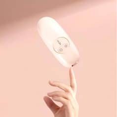 Wireless LED light therapy device for skin care and rejuvenation, stylish white design, easy-to-use controls, ideal for facial treatments.