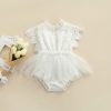 Elegant white baby dress with lace detailing and tulle skirt, perfect for special occasions and dressy events. Made from soft, high-quality fabric for comfortable wear. Ideal for baby's first celebrations or photo shoots.