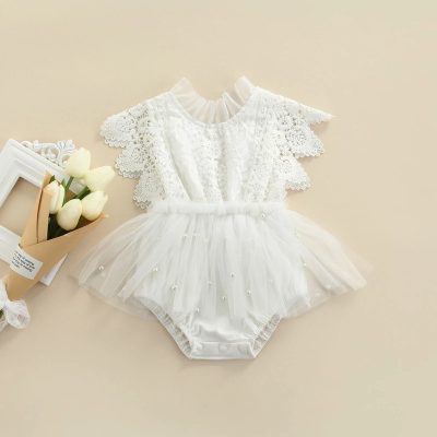 Elegant white baby dress with lace detailing and tulle skirt, perfect for special occasions and dressy events. Made from soft, high-quality fabric for comfortable wear. Ideal for baby's first celebrations or photo shoots.