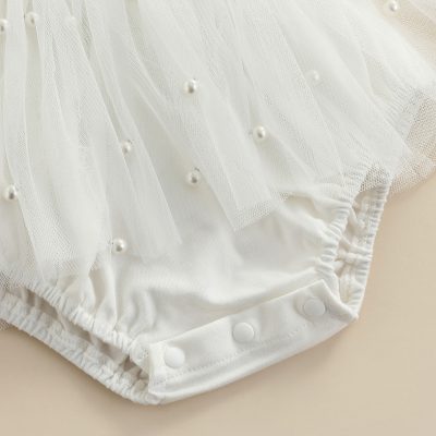 Elegant white baby romper with pearl embellishments and tulle overlay, perfect for special occasions and baby photoshoots. Stylish, comfortable, and adorable for your little one.